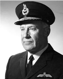 Head-and-shoulders portrait of man in dark military uniform wearing peaked cap
