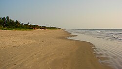 The beach stretching south towards the border to Guinea-Bissau