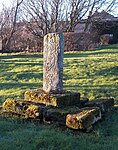 Cross in churchyard to north of Priory Church nave