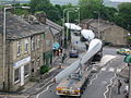 Image 3A turbine blade convoy passing through Edenfield in the U.K. (2008). Even longer 2-piece blades are now manufactured, and then assembled on-site to reduce difficulties in transportation. (from Wind power)