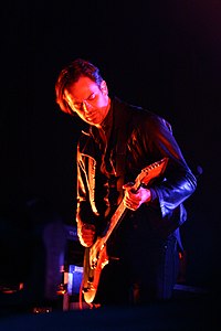 Fertita performing with Queens Of The Stone Age in 2014.