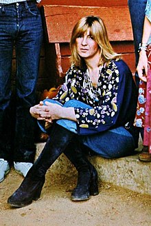 A photo of McVie sitting down