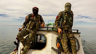 IRPGF fighters crossing Lake Assad by boat