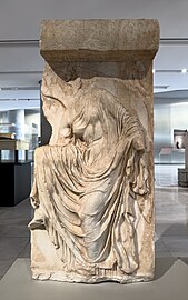 Nike adjusting her sandal, once part of the parapet beside the Temple of Athena Nike, c. 410 BC.