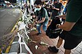 Several men clearing flowers in Hennessy Road