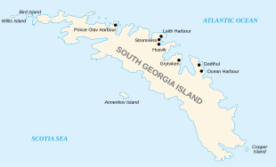 Outline of a long, narrow irregular-shaped island with small islands around its coasts. The main island is labelled "South Georgia", and various place names are shown on its north coast including Stromness Husvik and Grytviken.