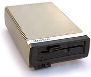 Atari 1050 disk drive sitting at a slight angle