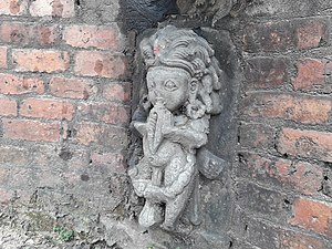 Bhagiratha beneath the stone spout of Lamugah Hiti, Bhaktapur, Nepal
