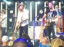 Country music duo Brothers Osborne at a concert in 2018.