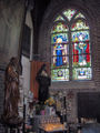 Chapel at the back of the Onze-Lieve-Vrouw-ter-Duinenkerk, Ostend, Belgium: stained glass representations of Saint Godelieve and Saint Idesbald.