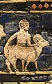 Detail of a man leading a ram on the peace panels of the Standard of Ur.