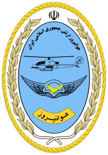 A blue egg-shaped seal with a golden border and with the Persian name of the unit at its top and its Persian acronym Havanirooz at bottom with a diagram of an AH-1J SeaCobra in the middle