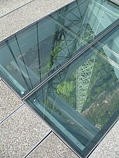 Sections of glass flooring being installed at the bridge