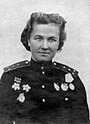 Photo of woman in decorated military uniform