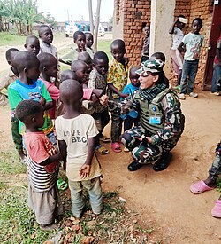 children with MONUSCO peacekeeper from Nepal