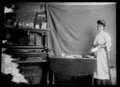 Woman in a kitchen in the Rainy River District, c. 1905.