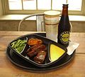 The ribs with a waffle and sides of green beans and cheese grits, purchased on opening day