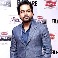 A picture of Karthi as he looks at the camera