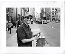 Christopher sketching on the streets of New York