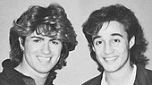 A black and white photograph of George Michael and Andrew Ridgeley of the group Wham!