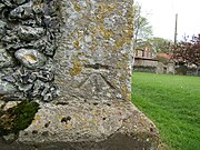 Benchmark at the base of the bell tower