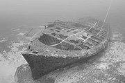 Underwater view of a shipwreck from its port bow