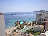 Photograph of the Eivissa Beach, a beach in Ibiza, with tall buildings fronting on it