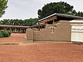 Gutiérrez Hubbell House in 2021, exterior adobe wall and entrance to interior courtyard structures and portal