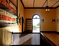 The second floor of the courthouse, as seen from the staircase, showing a portion of the 1898 Kingdom of Hawaii flag.