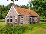 Red brick house with two chimneys