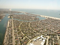 Belmont Park is in the foreground in this photo, with Naples Island is in the middle distance, and The Peninsula and the neighboring city of Seal Beach beyond, looking southeast.