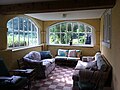 The sun room of a newly restored dependency of the mansion