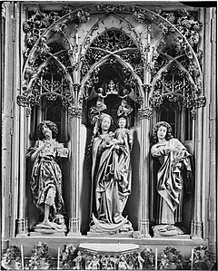 Statues of the high altar: Madonna on a crescent moon, with Johns Baptist and Evangelist (panel paintings).