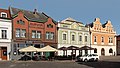 Rakovník, street view: Husovo náměstí met monumental houses