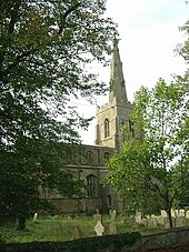 exterior view of church with tall spire