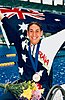 Australian disabled swimmer Priya Cooper holding the Australian flag after winning gold at the 1996 Summer Paralympics