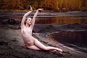 Photography model posing on a beach