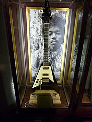 Gibson Flying V custom built for Jimi Hendrix, a belt worn by Jimi Hendrix, and a pair of rose-tinted sunglasses worn by Noel Redding - The Vault - Rock Memorabilia Museum, Hard Rock Cafe London (2022-03-26 02.11.00 by Marcus Grbac).jpg