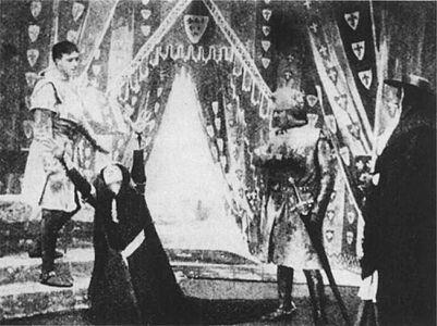 The Lamentation Scene: Act 2, Scene 1, corresponding to Act 3, Scene 4 in the original play. Lady Constance (front left) laments the capture of her son, Prince Arthur, as Lewis (rear left), Cardinal Pandulph (front right), and Philip of France (rear right) look on.