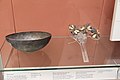 A bowl made out of silver and a head ornament (dated to c. 2700 – c. 2500 BCE)