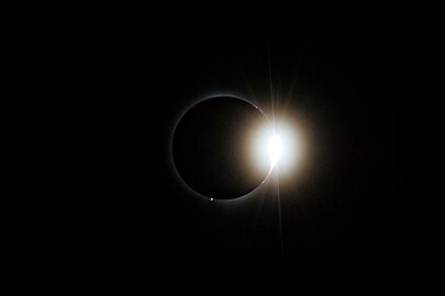 Post-totality diamond ring effect visible during the total solar eclipse of April 8, 2024, in Montreal, Quebec, viewed from Lower Field at McGill University.