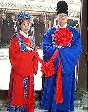 The bride at a traditional Chinese wedding dresses in red, the color of happiness and good fortune.