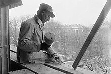 A photo of a construction worker building the Treasury Annex