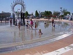 Fountains in Warren City Center, with farmer's market in background