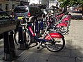 Image 37"Boris Bikes" from the Santander Cycles hire scheme waiting for use at a docking station in Victoria.