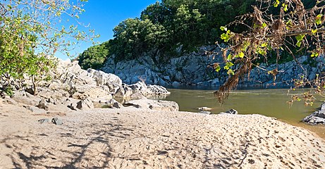 The Purplehorse "Beach". No swimming here: river is dangerous and people drown.