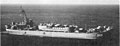 USS Blanco County (LST-344) underway off Guam in the 1960s with Army LCU-1517 land vehicles loaded on her main deck.