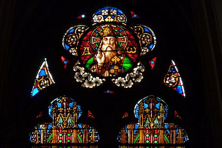 Top of central window in the axis chapel - "Alpha and Omega"