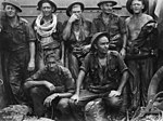 Engineers from the 2/13 Field Company rest after clearing the beach defences at Tarakan in May 1945