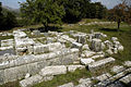 View NE from the theater-like seating area across the pronaos of the temple of Despoina with the Stoa in the distance